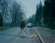 Man Standin`over Dead Dog