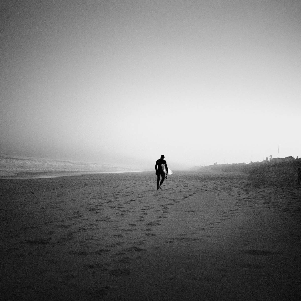 Surfare på strand